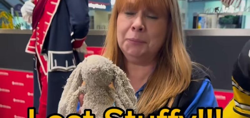 Airport employee with a stuffed rabbit that she found at the Pittsburgh International Airport. 