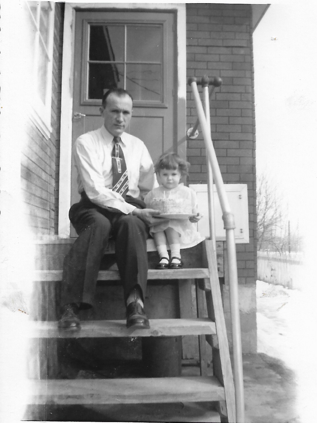 Me and my dad with our cake.