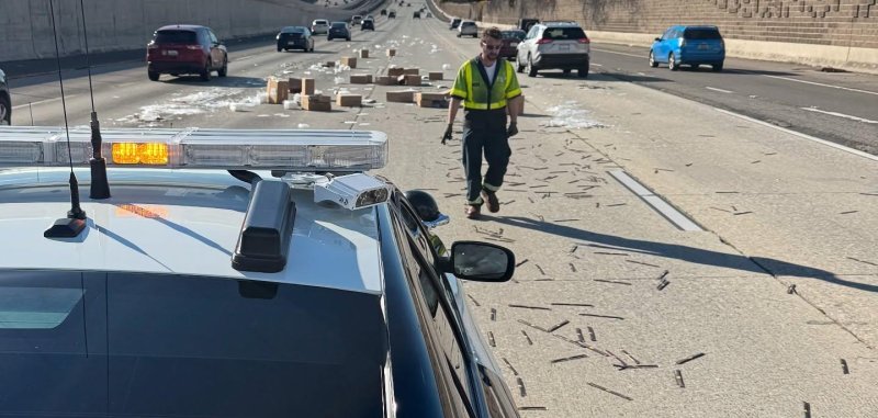 CHP officers picking up chopsticks that were spilled on Interstate 580  