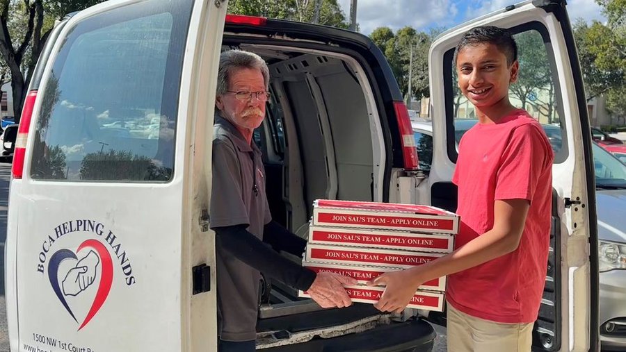 14 year old Boca Raton resident Anish Kaza handing pizzas to a local chariity. 14 year old Boca Raton resident Anish Kaza handing pizzas to a local chariity.