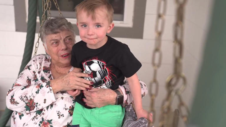 Sharon Lewis with her great grandson Bridger Peabody in her home in Colorado.