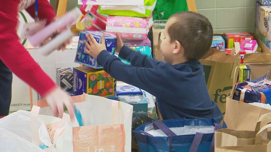 A child assisting an elementary school in making a difference in Green Bay. A child assisting an elementary school in making a difference in Green Bay.