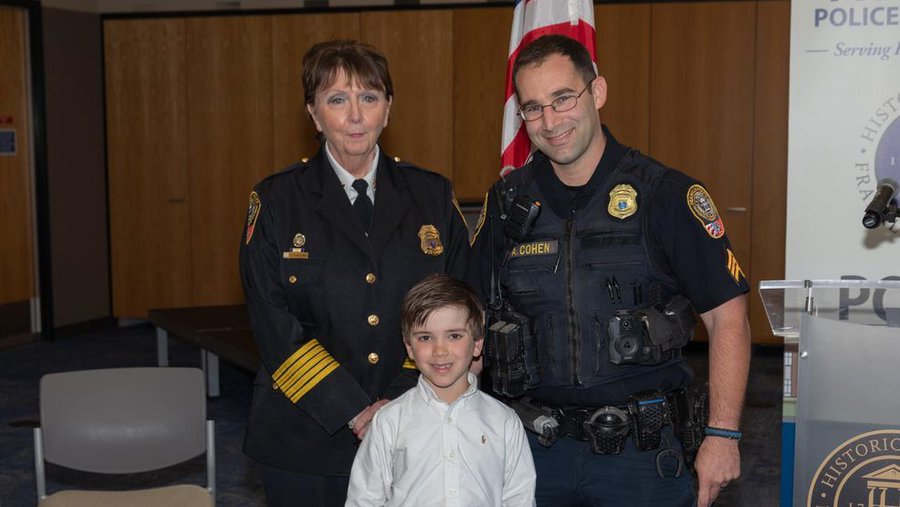 Franklin Police Chief with 7 year old boy Jacob Peters.