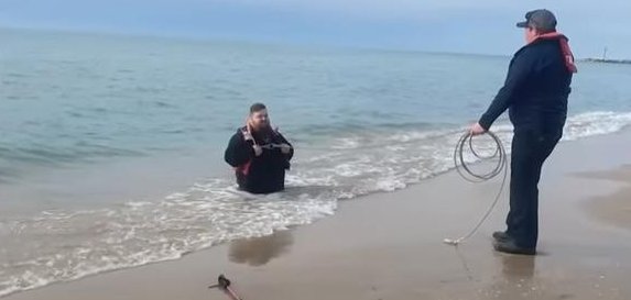 Michigan man rescued by his girlfriend and firefighters in a beach in April.