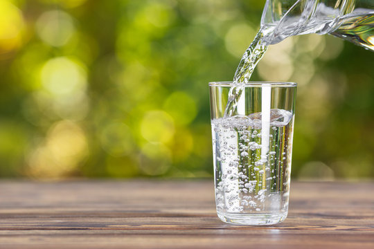 An adobe stock image showing water being poured into a glass