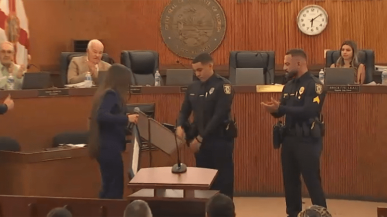 Hialeah Police officers receiving certificates for saving the life of a man in Florida  