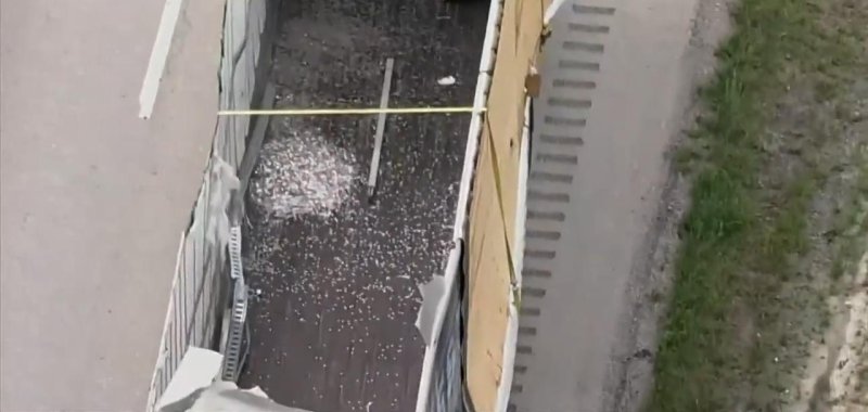 View from above of a truck accident that spilled 8 million dimes on a highway. 
