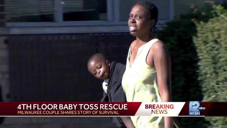 A mom holding her son after they escaped from a fire in Wisconsin.