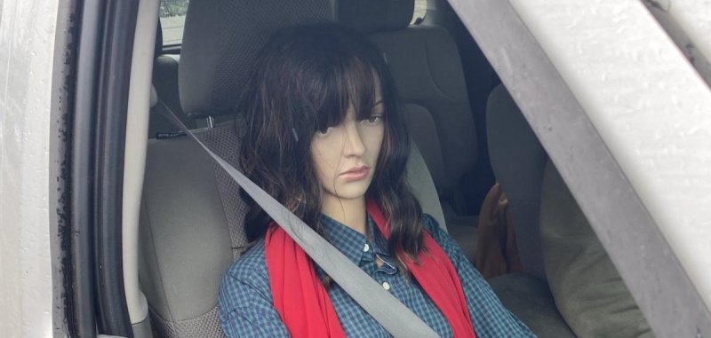 A dummy passenger riding inside of a vehicle in Washington state
