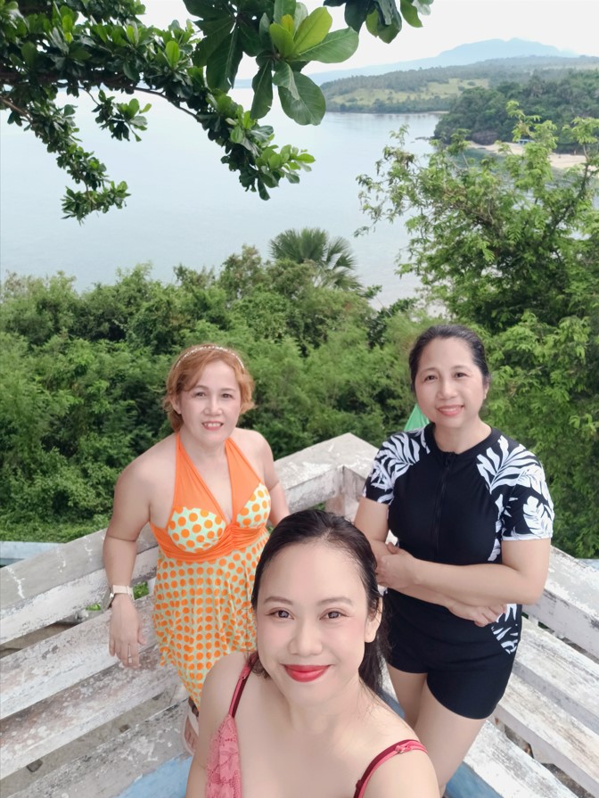 With my sister and daughter in law while at the deck overlooking the ocean