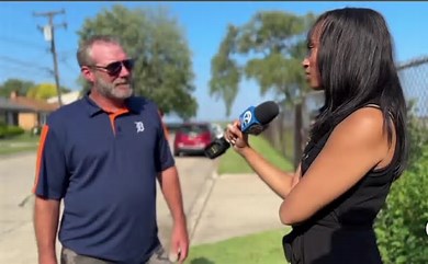 Richard Moore risks his life getting a driver out of a submerged auto in a lake.