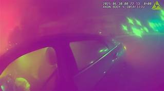 Police in Sarasota Florida save a female driver who in an auto accident.