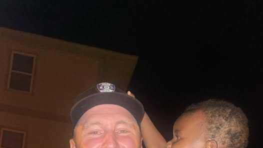 Covington Police Officer Michael Hess rescues a young boy who fell into a pool.