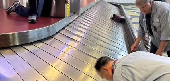 Employees at an airport in Pittsburgh retrieve a missing ring. 