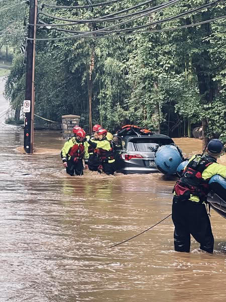 Firefighters in Bethesda Maryland rescue six persons in floodwater. Firefighters in Bethesda Maryland rescue six persons in floodwater.