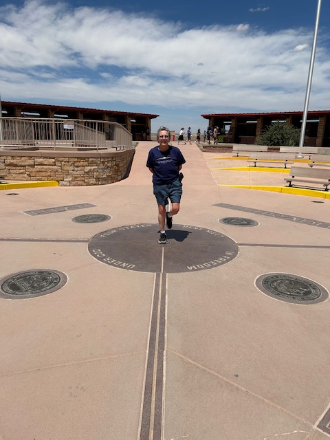 Four states, one foot!  Photo taken by a fellow visitor on FourWalls’ iPhone.