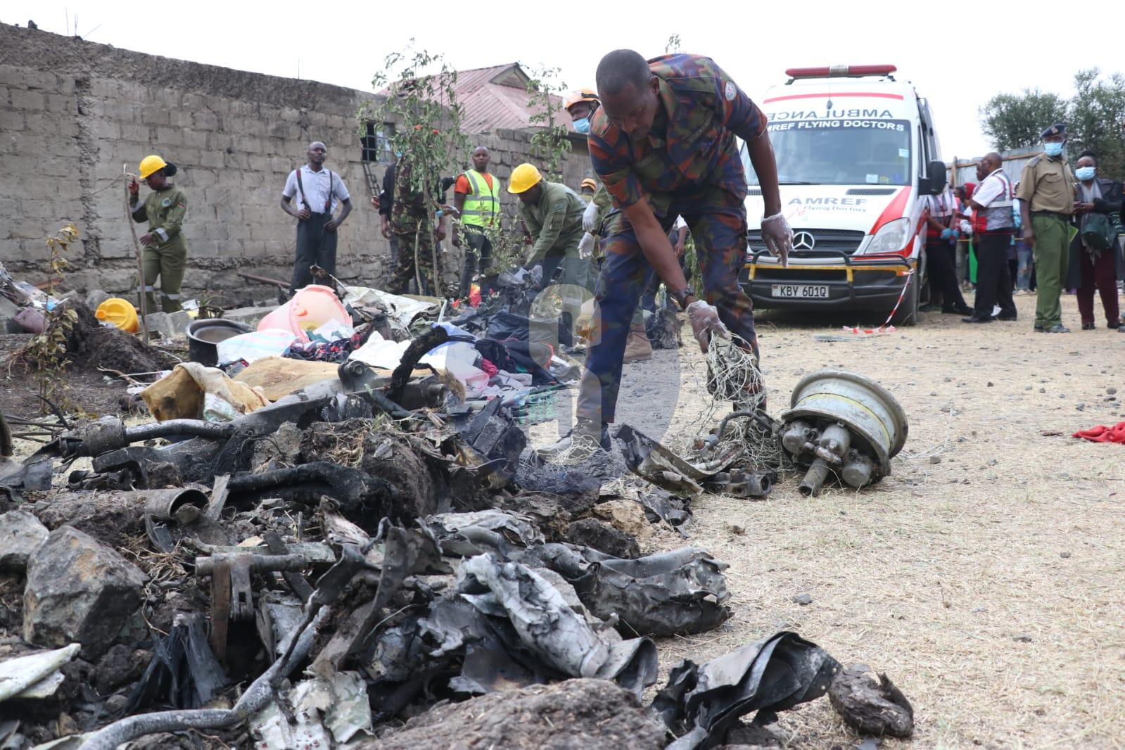 A Kenya Defence Force officer examines the remains of an AMREF aircraft that crashed leading to death of 8 people in Nairobi, Kenya on 07/08/2025 