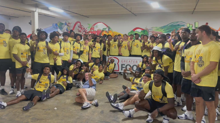 LSU football players giving back to their community.