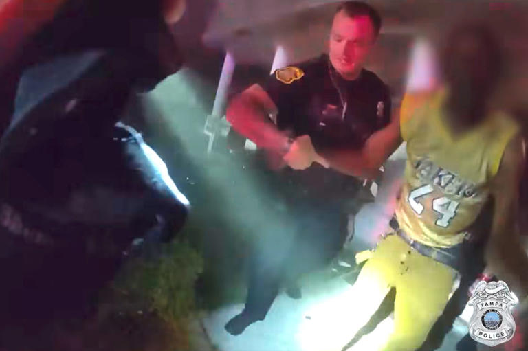 Tampa police officer rescues a man who in a house fire in Florida