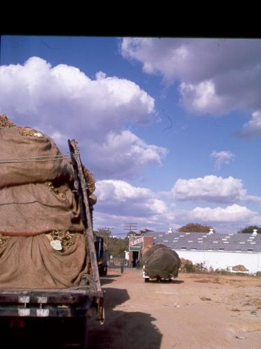 lorry -  large low horse-drawn wagon without sides  a large truck designed to carry heavy loads; usually without sides