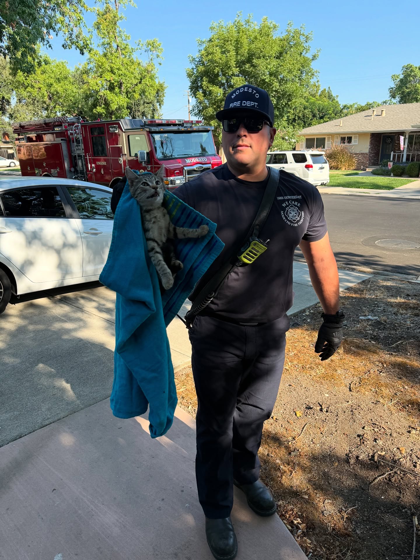 A firefighter in Fresno California rescues a kitten trapped in a soccer net