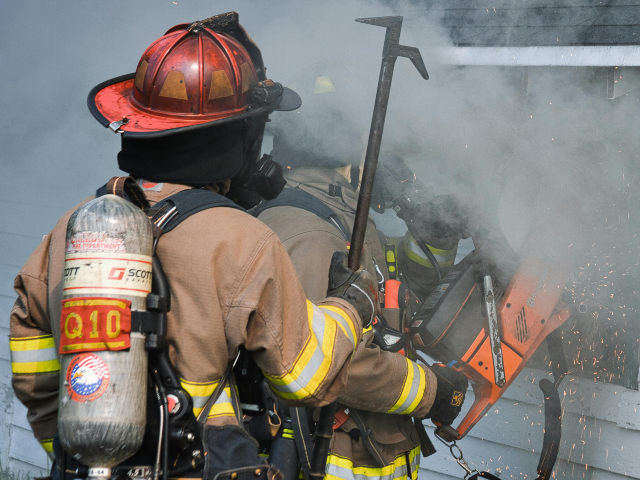 Firefighters in Chicago rescue a small dog who was inside of a burning home 