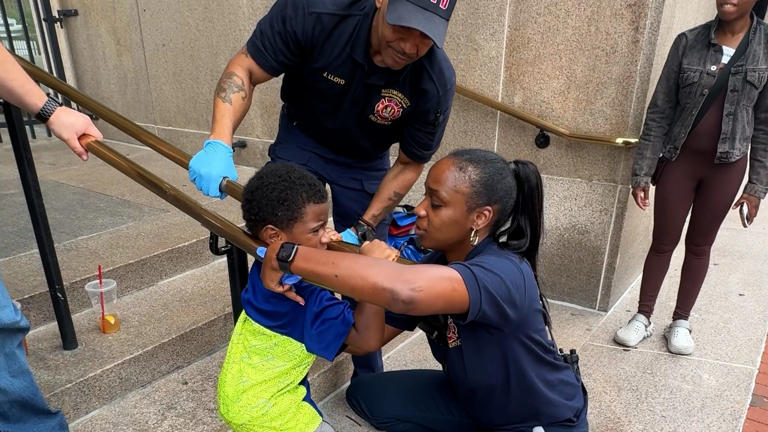 Baltimore Fire Department rescue a young boy who had his arm stuck on a guardrail