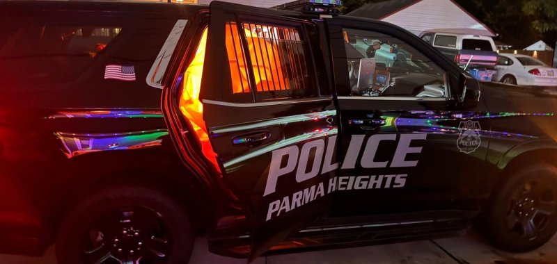 Parma Heights police car chasing a loose inflatable pumpkin on the street 