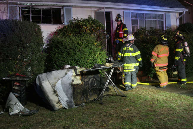 Firefighters in Fair Lawn New Jersey at the scene of a house fire 