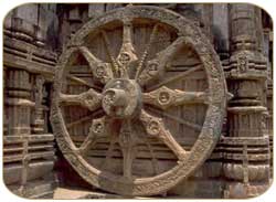 Sun Temple -  Konarak, Orissa - This is a photo of a chariot wheel of a giant horse-drawn chariot of the Sun. Together, the 24 wheels of the Chariot and the 7 horses drawing it symbolize the passage of time.   The temple city of Konark is situated in the eastern state of Orissa at a distance of around 65 km from Bhubaneswar and 35 km from Puri.The front of the main entrance has two giant stone lions crushing elephants.Konark derives its name from Konarka, the presiding deity of the Sun Temple. Konarka is a combination of two words, Kona (corner) and Arka (sun), which, when combined, means the sun of the corner. Konark was one of the earliest centres of Sun worshipping in India.  The temple was built by Raja Narasimhadeva(AD 1238-64) to mark a military victory over the Muslims. Konark was once a bustling port of Kalinga and had good maritime trade relations with Southeast Asian countries.  The temple fell into disuse in the early 17th century after it was desecrated by an envoy of the Mughal emperor Jahangir. Since the rulers used to worship the Sun, the temple was conceived as a chariot for Surya, the Sun God.