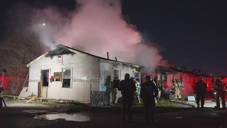 Firefighters in Houston Texas douse a fire on Monday 