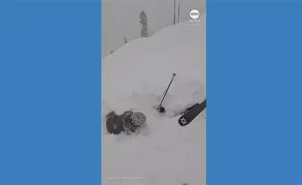 Two skiers rescue a skier who was trapped in deep snow in California