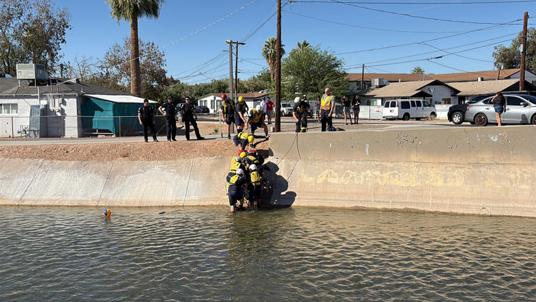 Firefighters in Phoenix Arizona rescue a woman who fell into a canal on Sunday Firefighters in Phoenix Arizona rescue a woman who fell into a canal on Sunday
