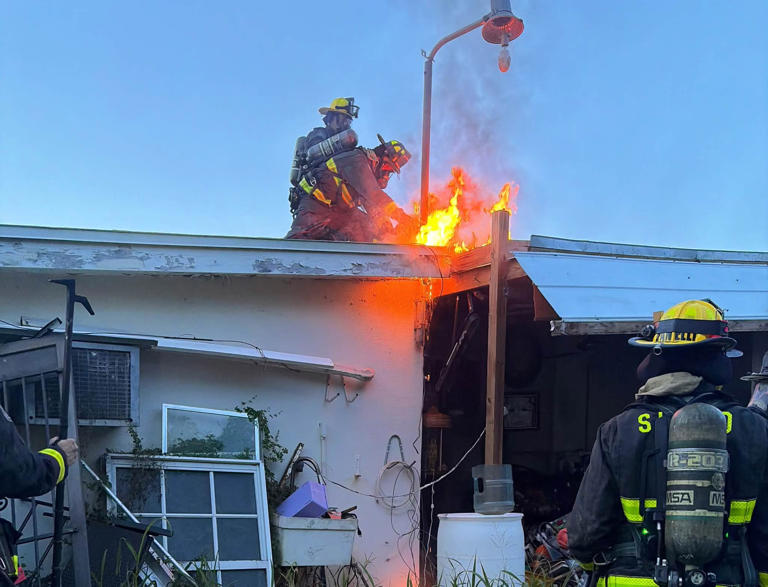 Firefighters put out a house fire in Port St. Lucie Florida Firefighters put out a house fire in Port St. Lucie Florida