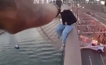 New York Police Department officer rescues a woman who was at the Brooklyn Bridge New York Police Department officer rescues a woman who was at the Brooklyn Bridge