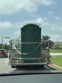 A REAL port-a-potty, at a red light in front of me earlier this week! Photo taken by and the property of FourWalls. A REAL port-a-potty, at a red light in front of me earlier this week! Photo taken by and the property of FourWalls.