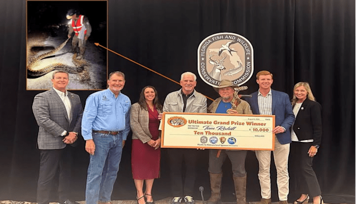 Tom Rahill with his prize of $10,000 dollars for removing pythons in a Florida lake Tom Rahill with his prize of $10,000 dollars for removing pythons in a Florida lake