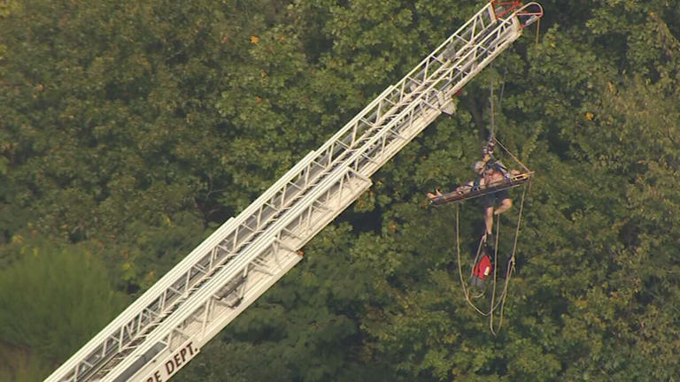 Emergency crews rescue a person who was in an embankment in Charlotte N C Emergency crews rescue a person who was in an embankment in Charlotte N C