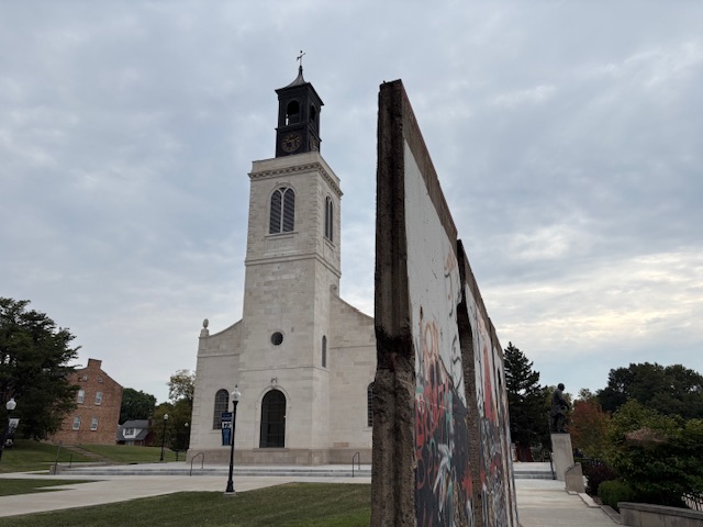 St. Mary the Virgin Aldamanbury in the background with “Breakthrough,” made from the Berlin Wall, in the foreground.  Photo taken by and the property of FourWalls.