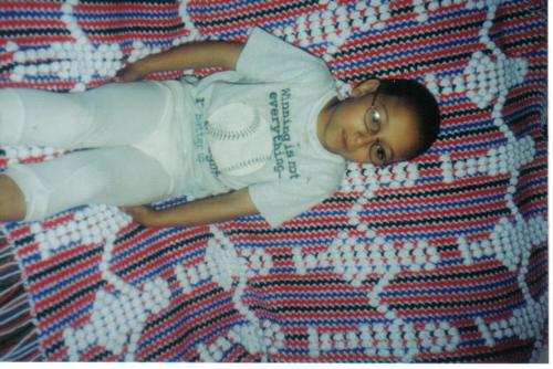My son w/ an afghan that I crocheted. - My son w/ an afghan that I crocheted.