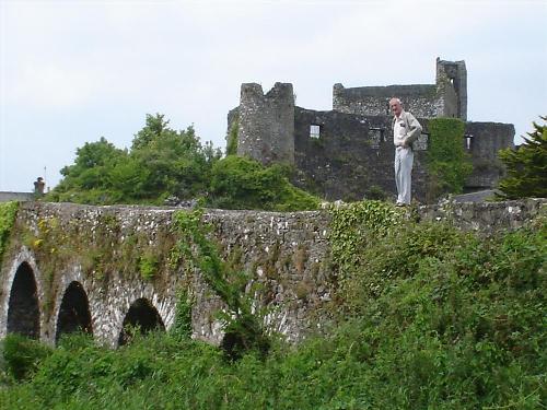 Roche Castle - Ireland - This is a photgraph of my grandpa standing outside one of our ancestors castles in Ireland.  It is Roche Castle near Castletown Roche.