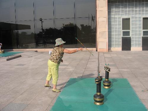 Action shot taken with the Canon A530 - This is a shot I took in Korea of a lady playing a traditional Korean Game.  Notice how the camera stopped the action of the stick stopping in mid air and it is not blurry.  This camera is the one that I am teaching my 4 year old granddaughter on to take pictures.  She took my picture for MyLot using the camera with the flach.  You can see two pictures taken using this camera