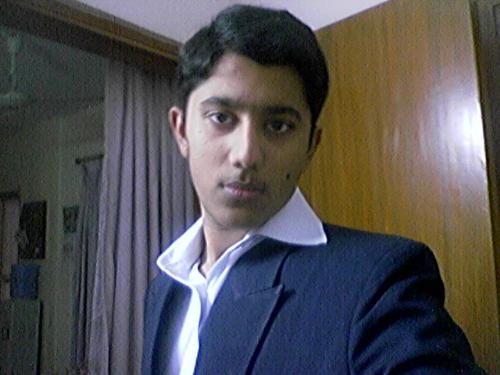 Habib - my brother  took the photo when i was getting ready for my sister's wedding.