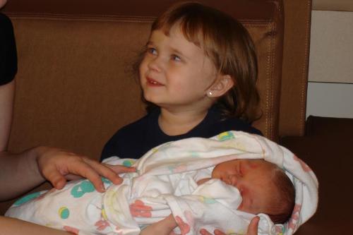 Mia and her new cousin - This is a picture of my daughter that was taken in the hospital the first time she met her new cousin Dominic.