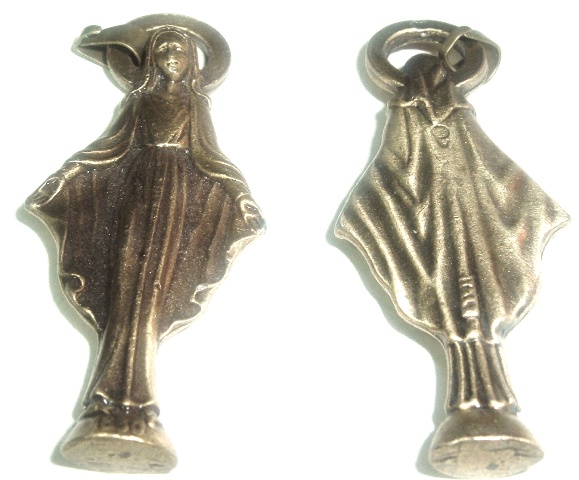 Blessed Mother Apparition in France  - Blessed Mother Apparition in France     This medal measures 2 inches tall and is made out of solid brass.  This medal or pendant shows our Blessed Mother and has the year 1930  at the bottom. The year that she appeared to Sister Catherine Laboure telling her about the Immaculate Conception and  also the Miraculous medal.   Catherine Laboure was born in Burgundy on May 2, 1806 as the 9th of 11 children to a farmer family. In 1830 Catherine entered the Sisters of Charity and after a few months she was sent to the motherhouse at rue du Bac in Paris.   On November 27, 1830, during evening prayer, the Virgin Mary appeared to Catherine in the convent chapel, standing on a large globe with dazzling rays of light streaming from her outstretched hands. An oval shape appeared around the Blessed Virgin with the inscription: “O Mary conceived without sin, pray for us who have recourse to thee”.    The Virgin instructed Catherine to have a medal made of this vision, spreading the word that those who wore it around the neck would receive great graces. The vision then seemed to turn to show the reverse of the Medal: the letter M surmounted by a cross with a bar at its base; below this monogram, the Sacred Heart of Jesus crowned with thorns, and the Immaculate Heart of Mary pierced with a sword.   Catherine asked how she was to have this medal struck and Mary told her to consult her confessor for help. Catherine did as she was told but her confessor, Father Aladel, at first did not believe her, but after two years, he finally went to the archbishop. With approval of the Church, two thousand medals were struck and distributed in Paris in 1832. Almost immediately the blessings that Mary had promised began to shower down on those who wore her Medal. The devotion spread like wildfire as a flood of reported cures and spiritual conversions were attributed to the medal. Before long people were calling it the Miraculous Medal.   By autumn of 1834 there were already 500,000 medals in existence and in 1835 more than one million worldwide. In 1836, a Canonical inquiry undertaken at Paris declared the apparitions to be genuine and in 1876 more than a billion medals were distributed. Father Aladel kept Catherine’s identity secret and until shortly before her death in 1876, nobody knew who had begun the devotion.