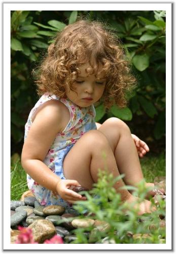 Collecting stones!!! - Baby engaged in collecting stones....