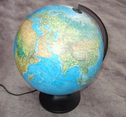 World is round - A globe is usually mounted at an angle on bearings. In addition to making it easy to use this mounting also represents the angle of the planet in relation to its sun and the spin of the planet. This makes it easy to visualize how days and seasons change. Largest Globes  in the world made by man. 1. Eartha, currently the world's largest rotating globe (41 feet in diameter), at the Delorme headquarters in Yarmouth, Maine  2. The Mapparium, 30 foot walk-in globe at the Christian Science complex in Boston, intended to be viewed from within.  3. The Babson globe in Wellesley, Massachusetts, a 26-foot diameter globe which originally rotated on its axis and on its base to simulate day and night and the seasons  4. The giant globe in the lobby of The News Building in New York City.