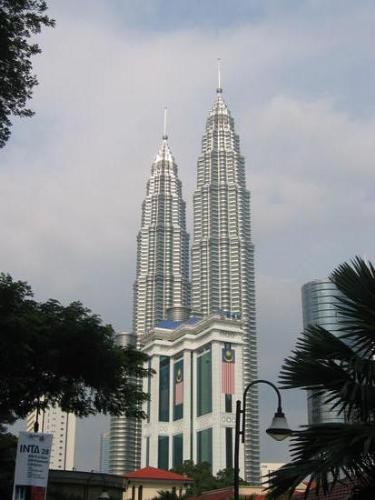 Malaysia&#039;s Twin towers - shot of Malaysia&#039;s Patronus Twin towers. These are the tallest twin towers in the world. On tower was built by the Japanese, the other by Korea. The design follows an Islamic theme. 