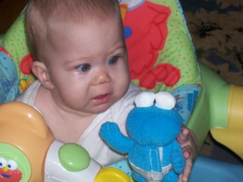 What is it!?! - My newest little angel taking on the cookie monster of her very first toy.