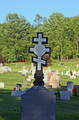 Eastern Orthodox Cross - Have you ever wandered through a cemetery and wondered about the meanings of the designs carved on old gravestones? Thousands of different religious and secular symbols and emblems have adorned tombstones through the ages, indicating attitudes towards death and the hereafter, membership in a fraternal or social organization, or an individual's trade, occupation or even ethnic identity. While many of these tombstone symbols have fairly simple interpretations, it is not always easy to determine their meaning and significance. We were not present when these symbols were carved into the stone and can't claim to know our ancestors' intentions. They may have included a particular symbol for no other reason than because they thought it was pretty.  While we can only speculate what our ancestors were trying to tell us through their choice of tombstone art, these symbols and their interpretations are commonly agreed upon by gravestone scholars.     The Eastern Orthodox Cross is distinctively different from other Christian crosses, with the addition of two extra cross beams.